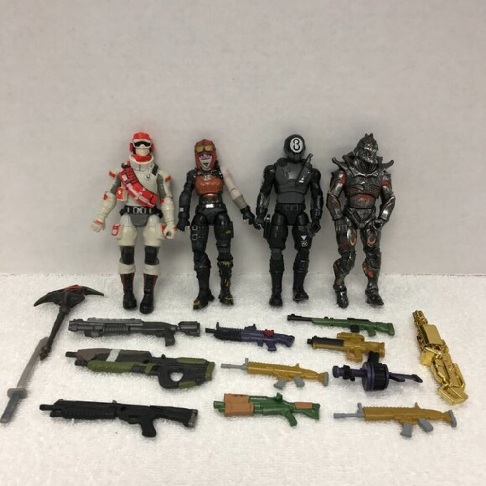 lot of 4 Fortnite action figures with an arsenal of weapons